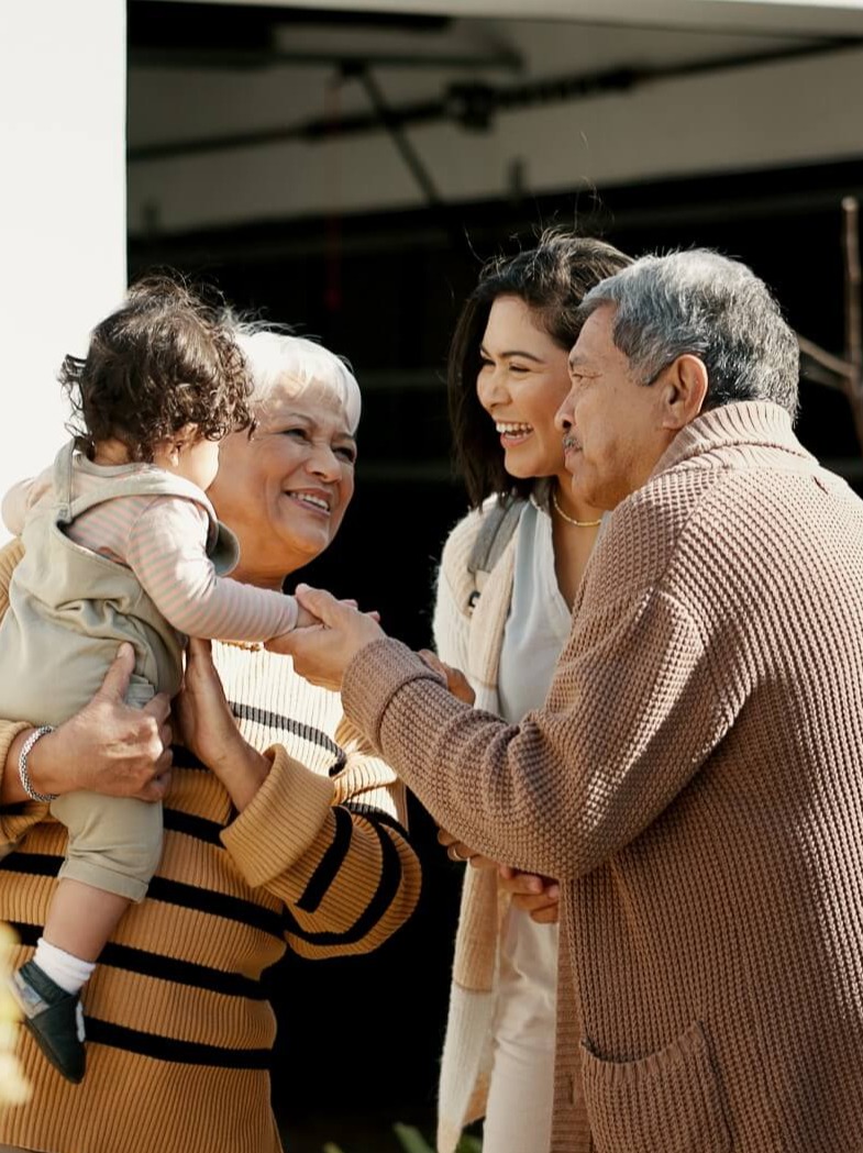 grandparents visiting with daughter and grandaughter