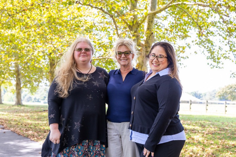Three members of the Stecher Financial Group team outdoors