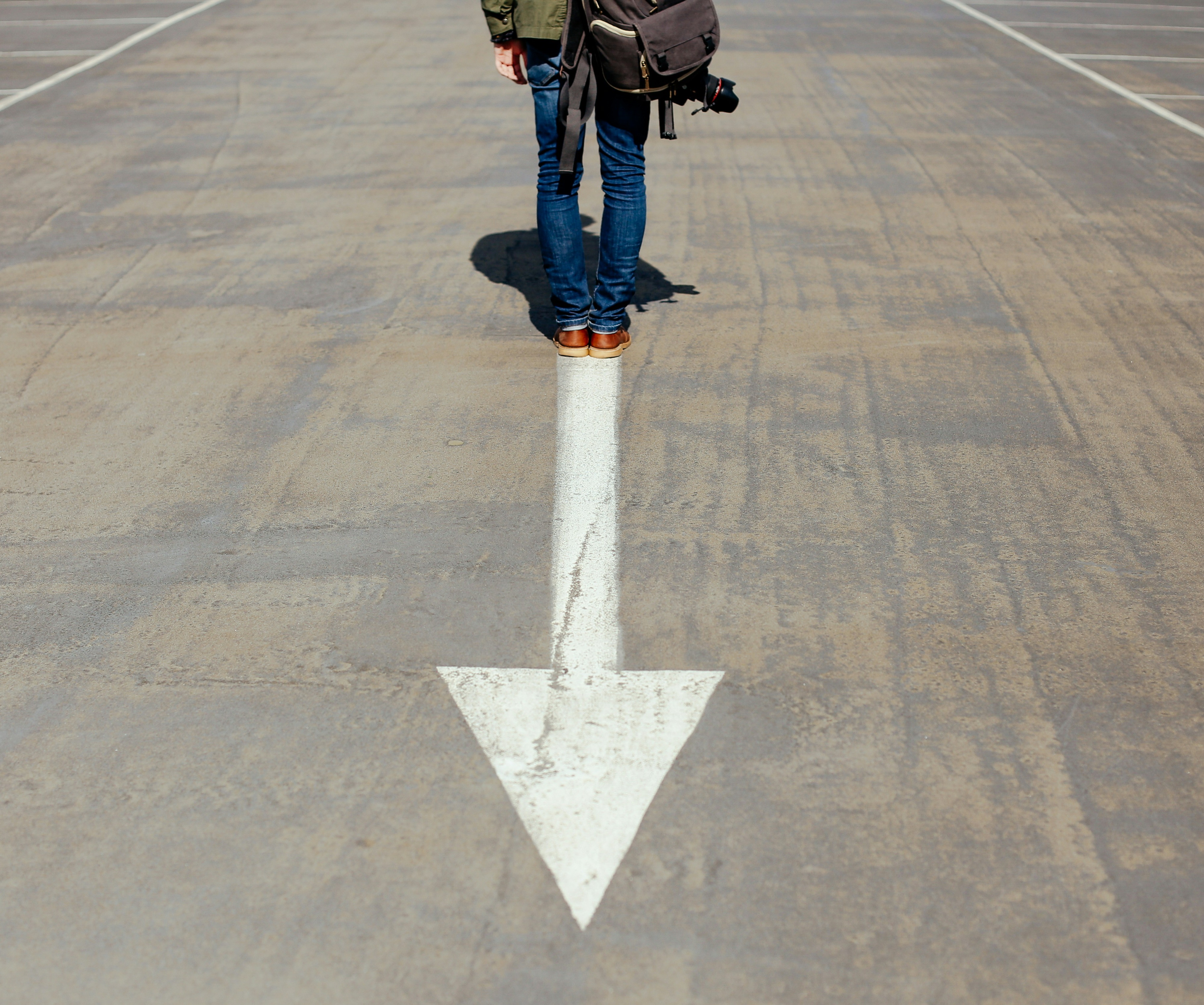 Person standing on an arrow