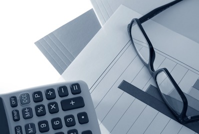 Close-up of glasses and calculator