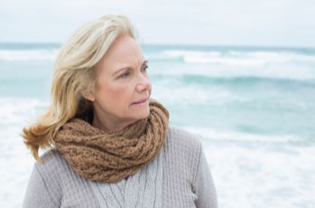 Elderly woman at a beach