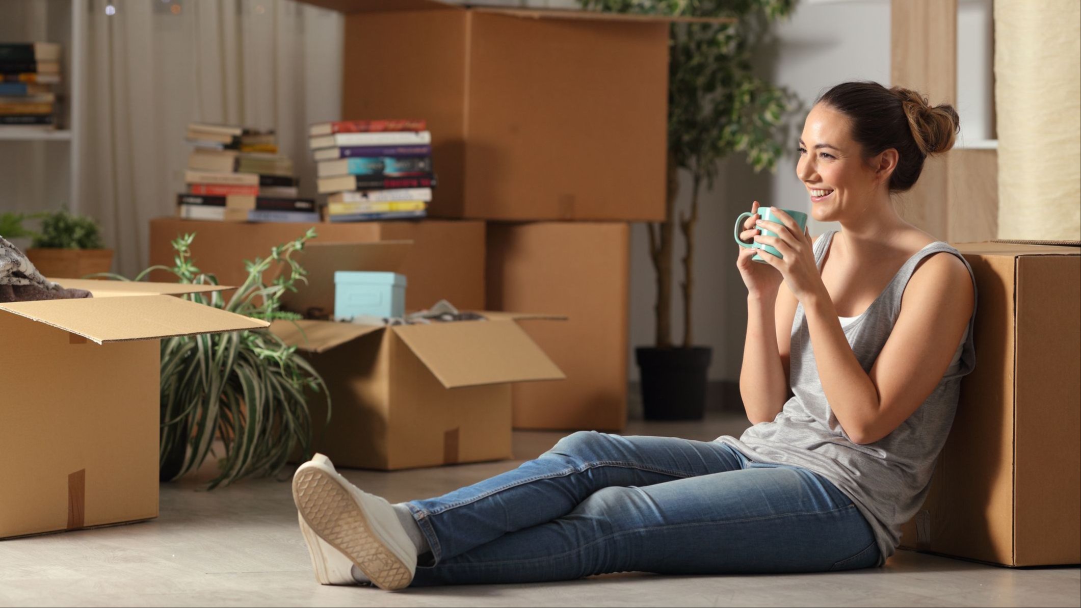 Photo image of a renter lounging before completing the unpacking