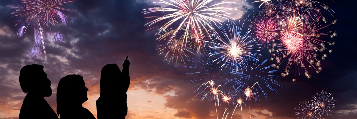 family-watching-fireworks-together