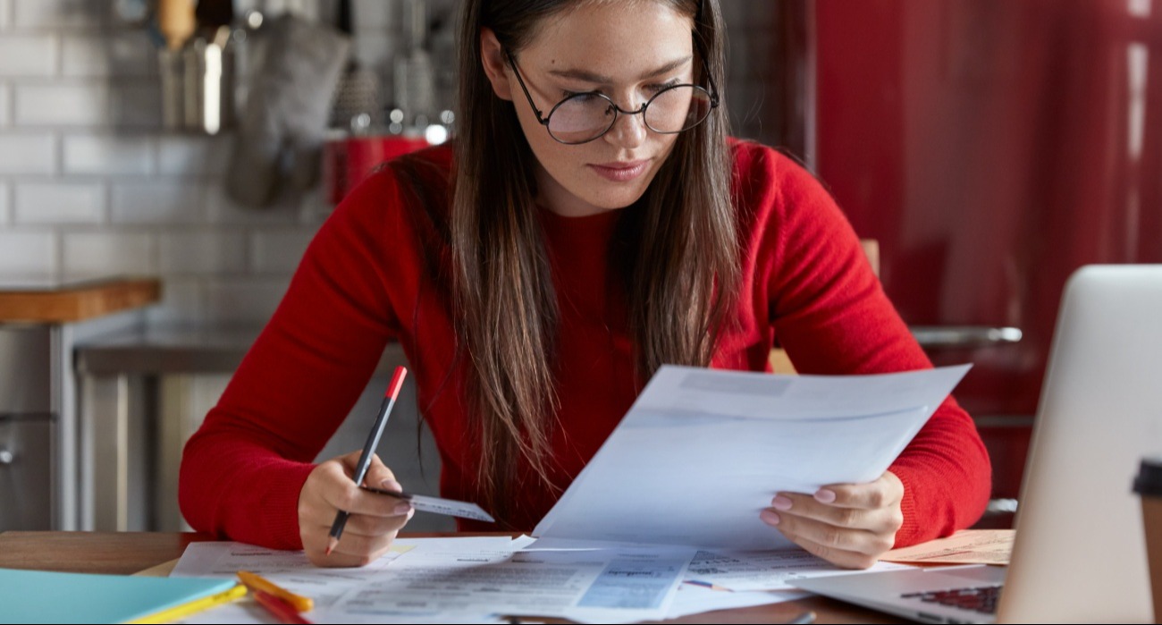 Woman checking a tax document