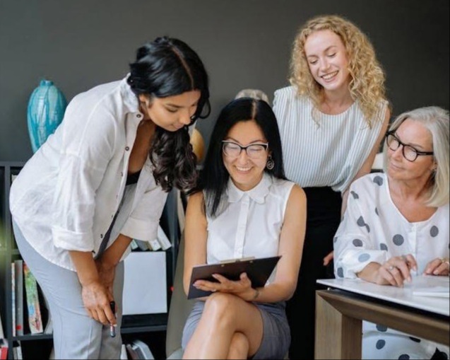 Financial planning for women in Oklahoma City — a group of women reviewing financial documents together, Advance Financial Lighthouse
