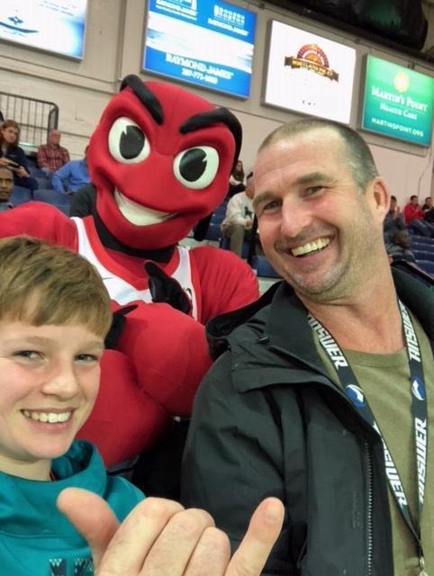 father and son at an indoor sporting event