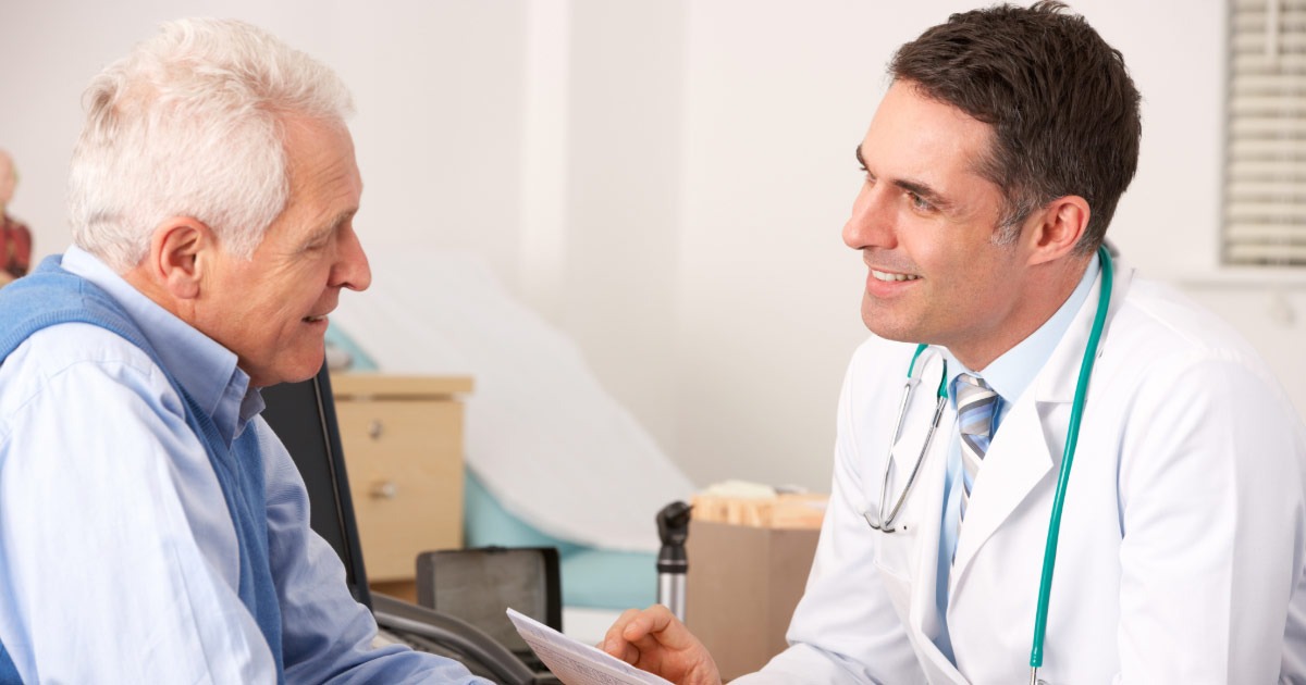 Doctor consulting with his elderly patient