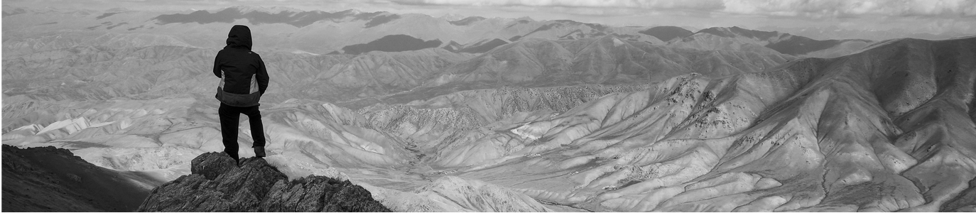 Person standing at a mountaintop