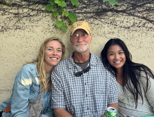 Olivia at dinner with her sister and dad
