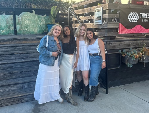 Olivia and friends attend a concert