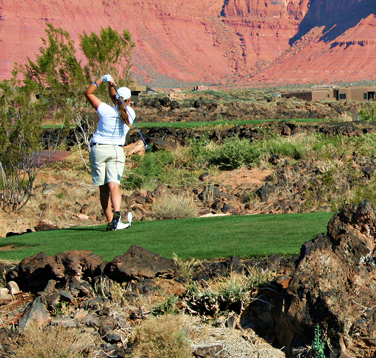 Golfing with a red rock background