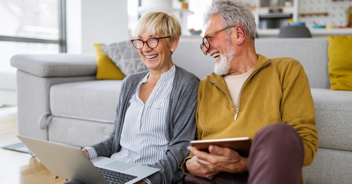 Older couple retirement planning and laughing