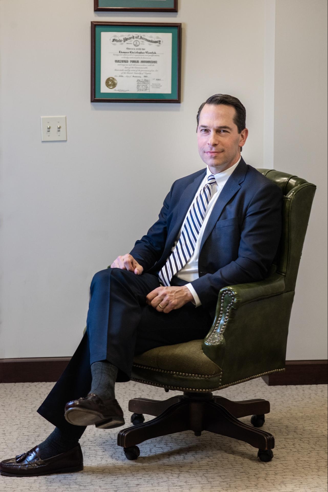 Tom in front of an award