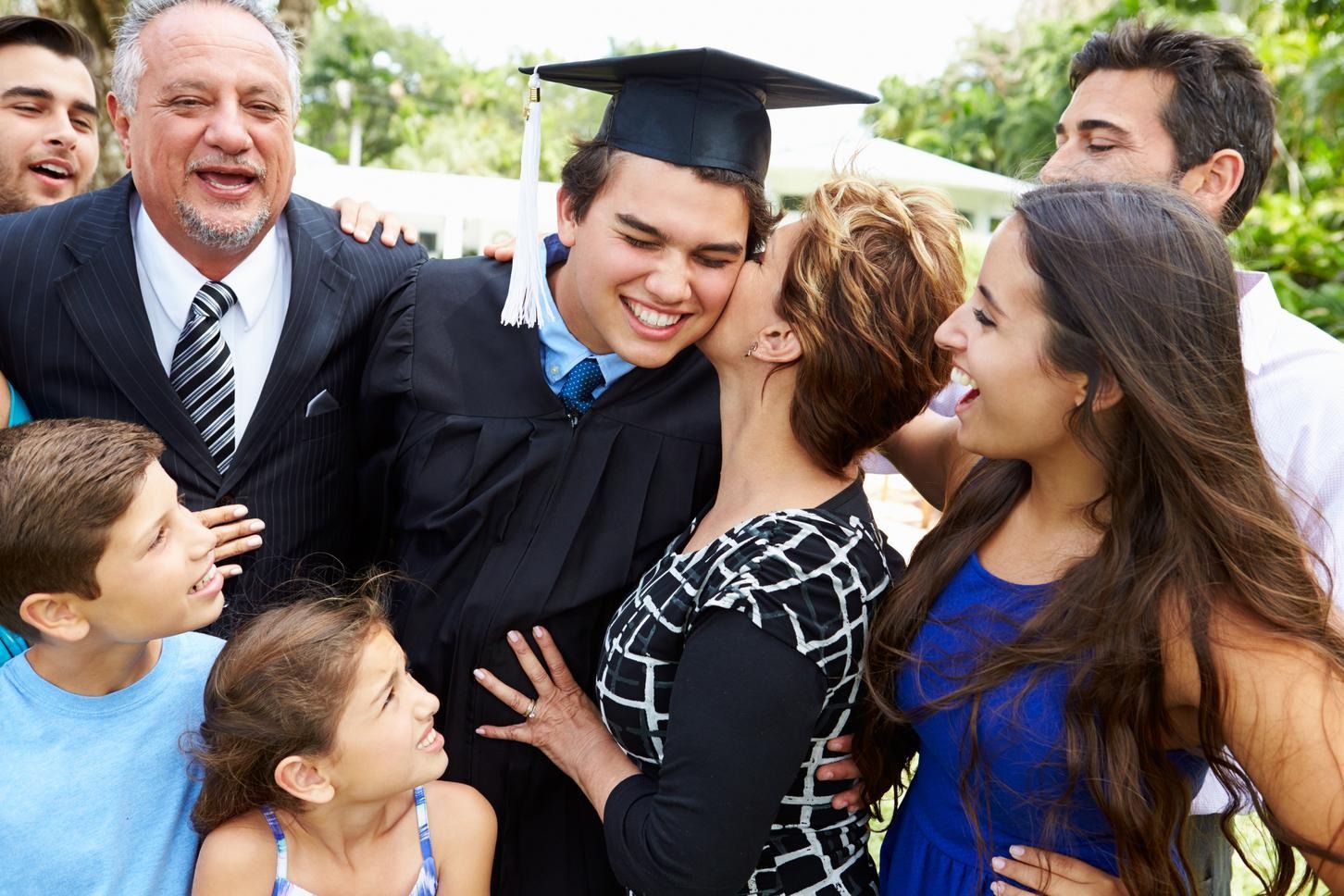 Outdoor - Graduation, student and his family celebrating