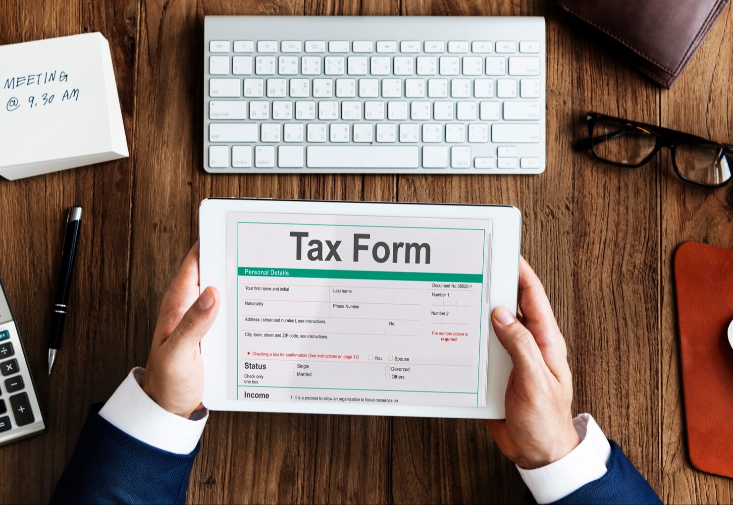 person holding a tax form