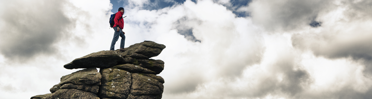 Man hiking on top of rocks