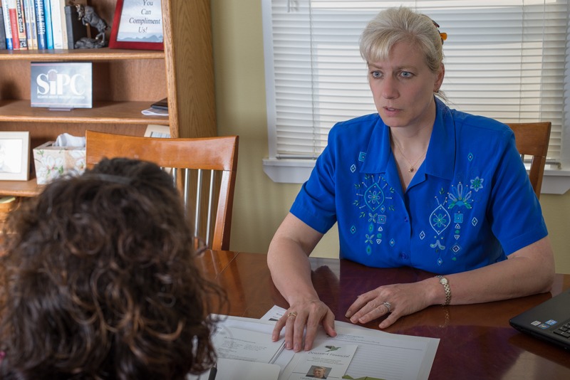 Cindy meeting with a client.