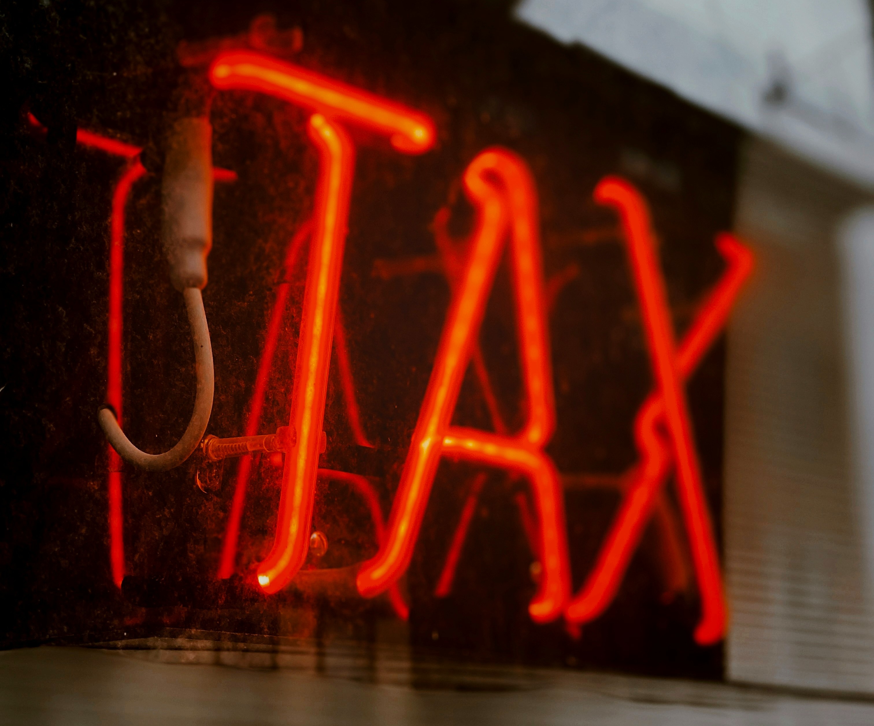 Neon Sign that says TAX