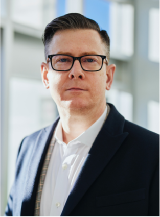 Man in a suit with glasses