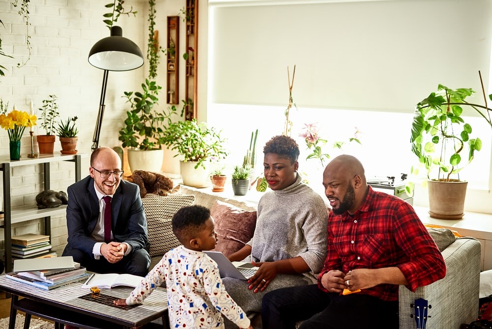 Image of agent meeting with family