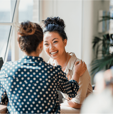 Female colleagues assure each other