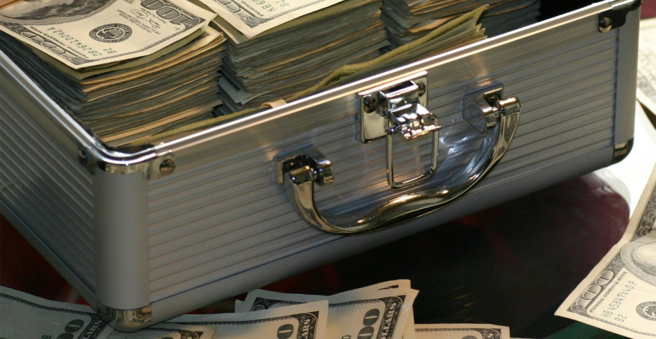 Photo image of a suitcase full of money