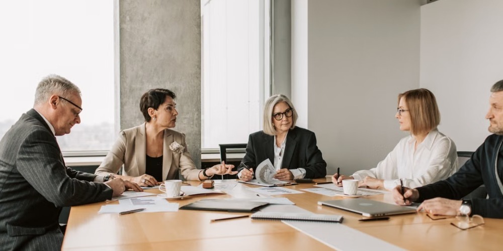 Business executives discussing paperwork 