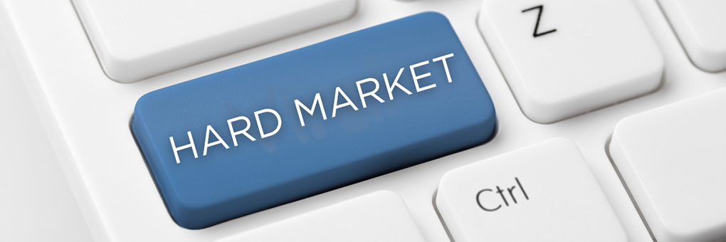 Photo of part of a keyboard with one key that says Hard Market