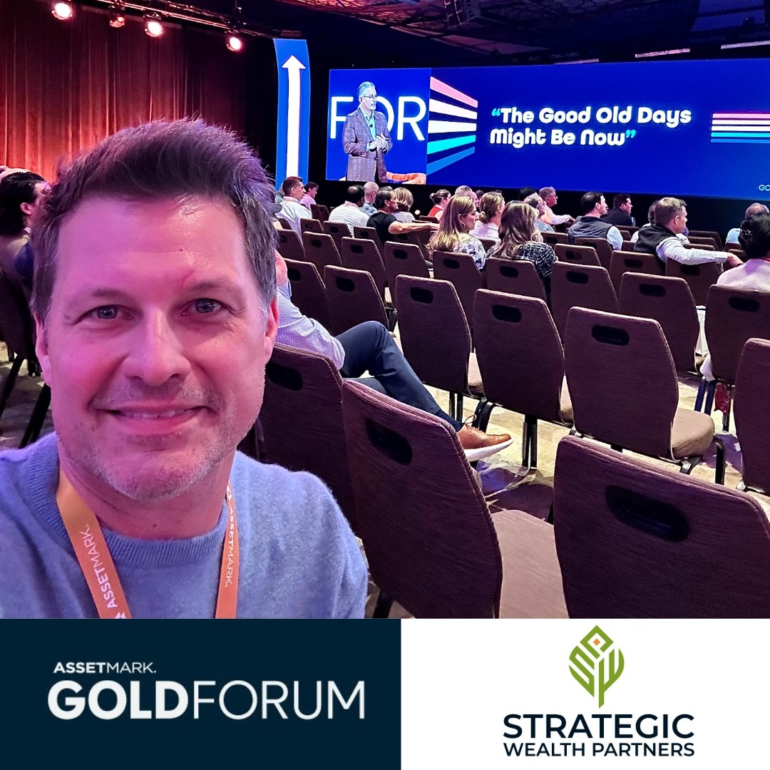 AssetMark Gold Forum card showing Neill seated in a conference session