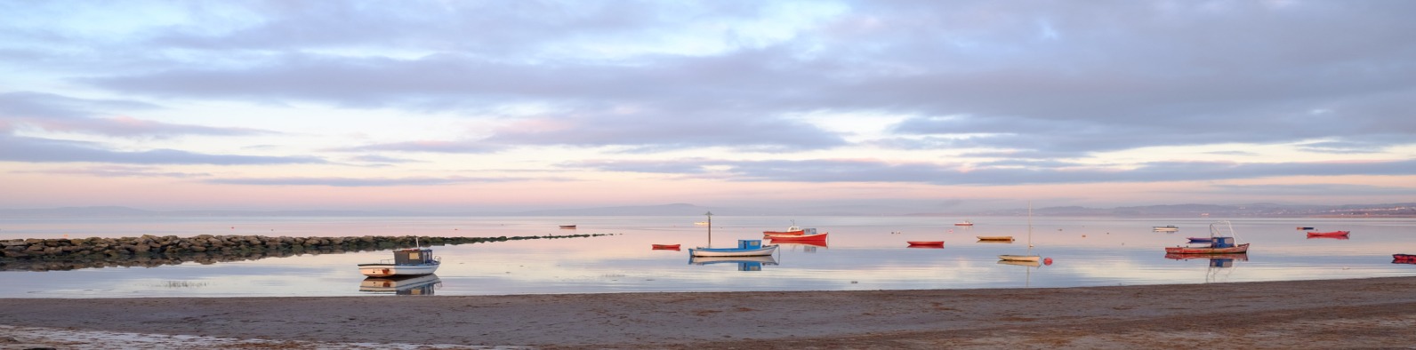 Winter scene with boats on a river