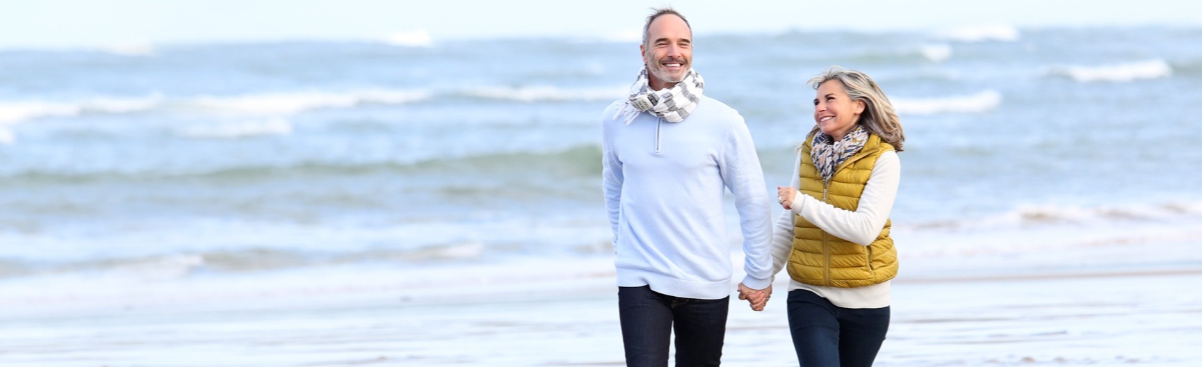 Couple walking together on the beach