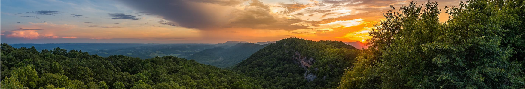 View of mountains and forest during sunset