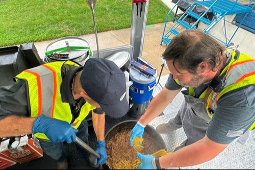 two workers working outdoors