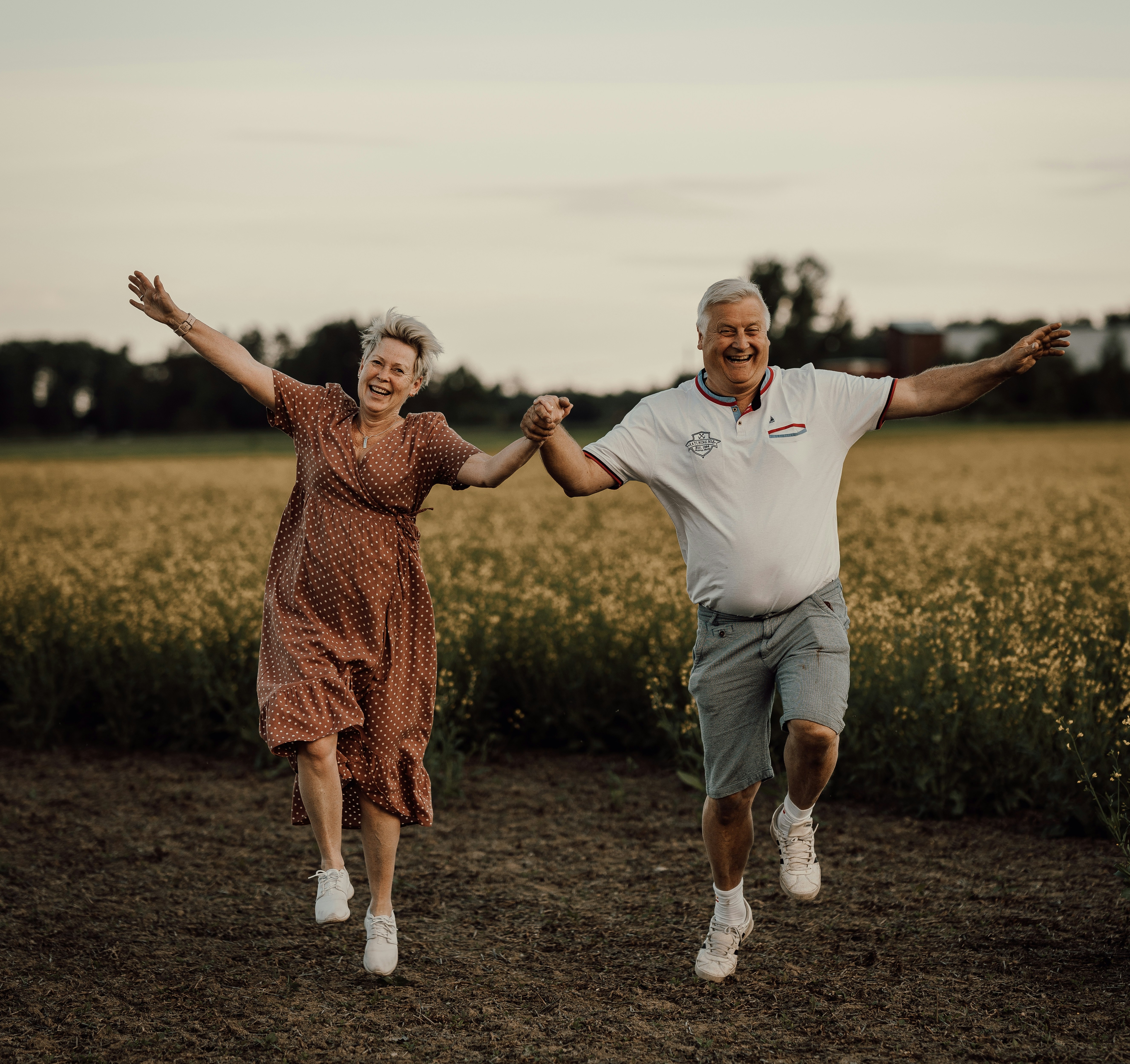 Retirees dancing in a field