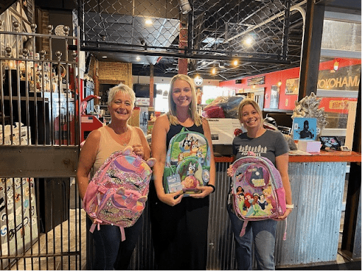 SFS team holding backpacks
