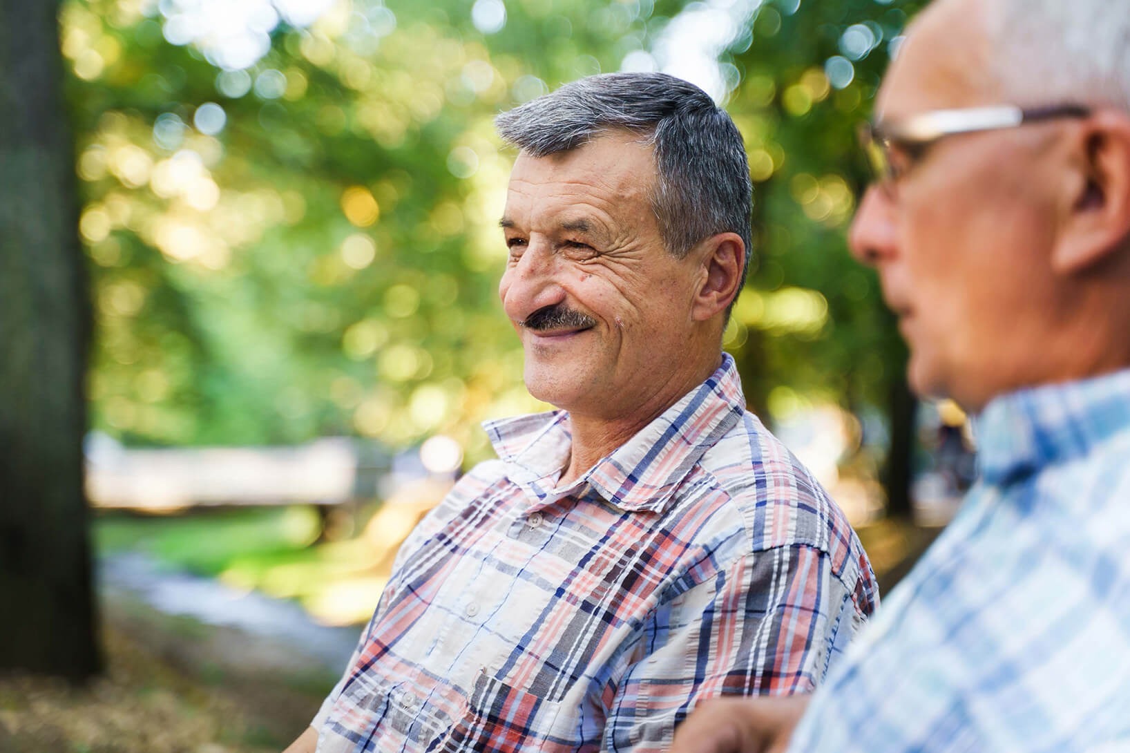 Two gentleman on a park bench