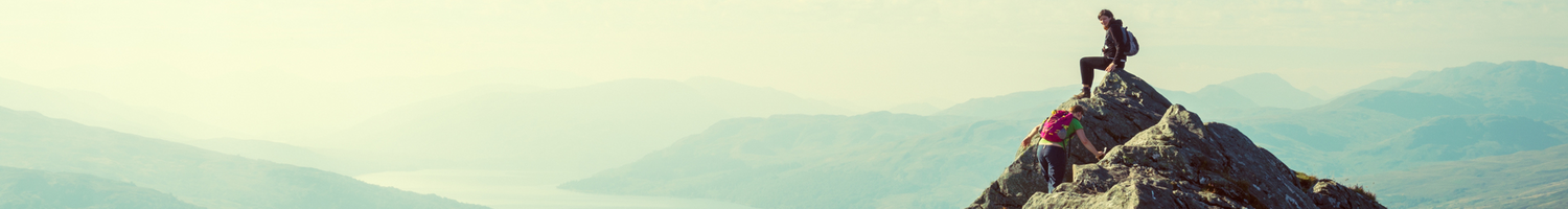 Two people on top of a mountain