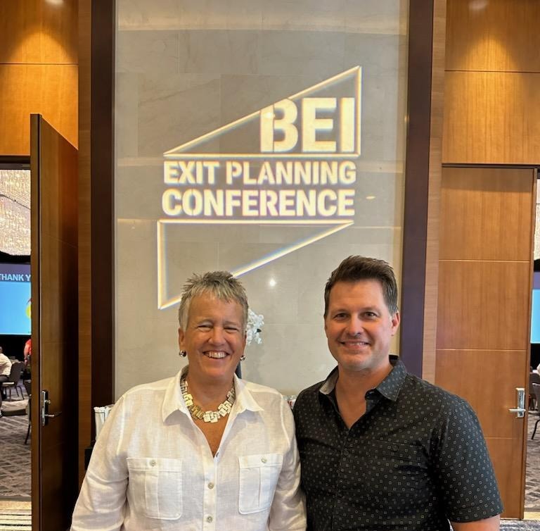 Karen Jessey & Neill Turner smiling at the camera at the annual BEI Exit Planning Conference in DenverExit P