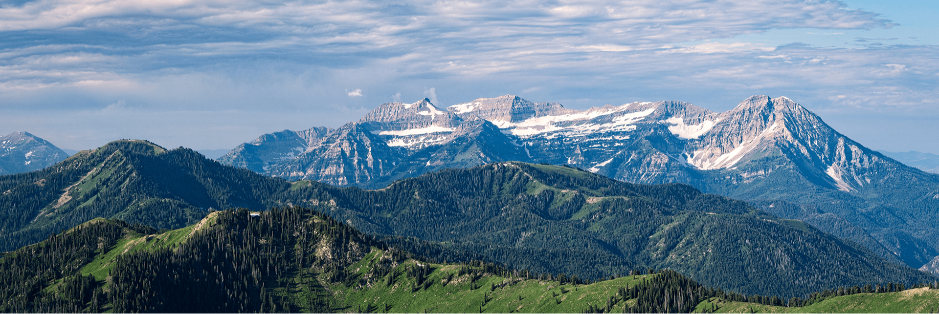 Cloudy view of snow capped mountainside