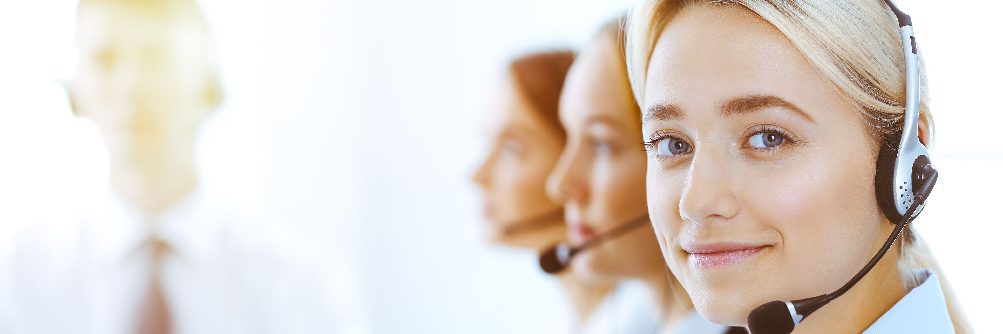 Representative wearing phone head-set ready to take a claims call