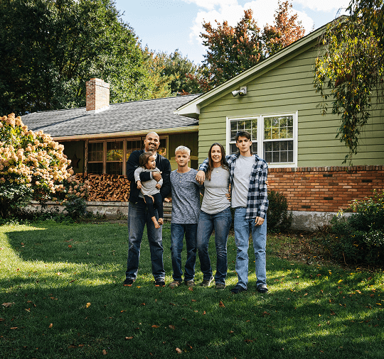 Family in front of a house