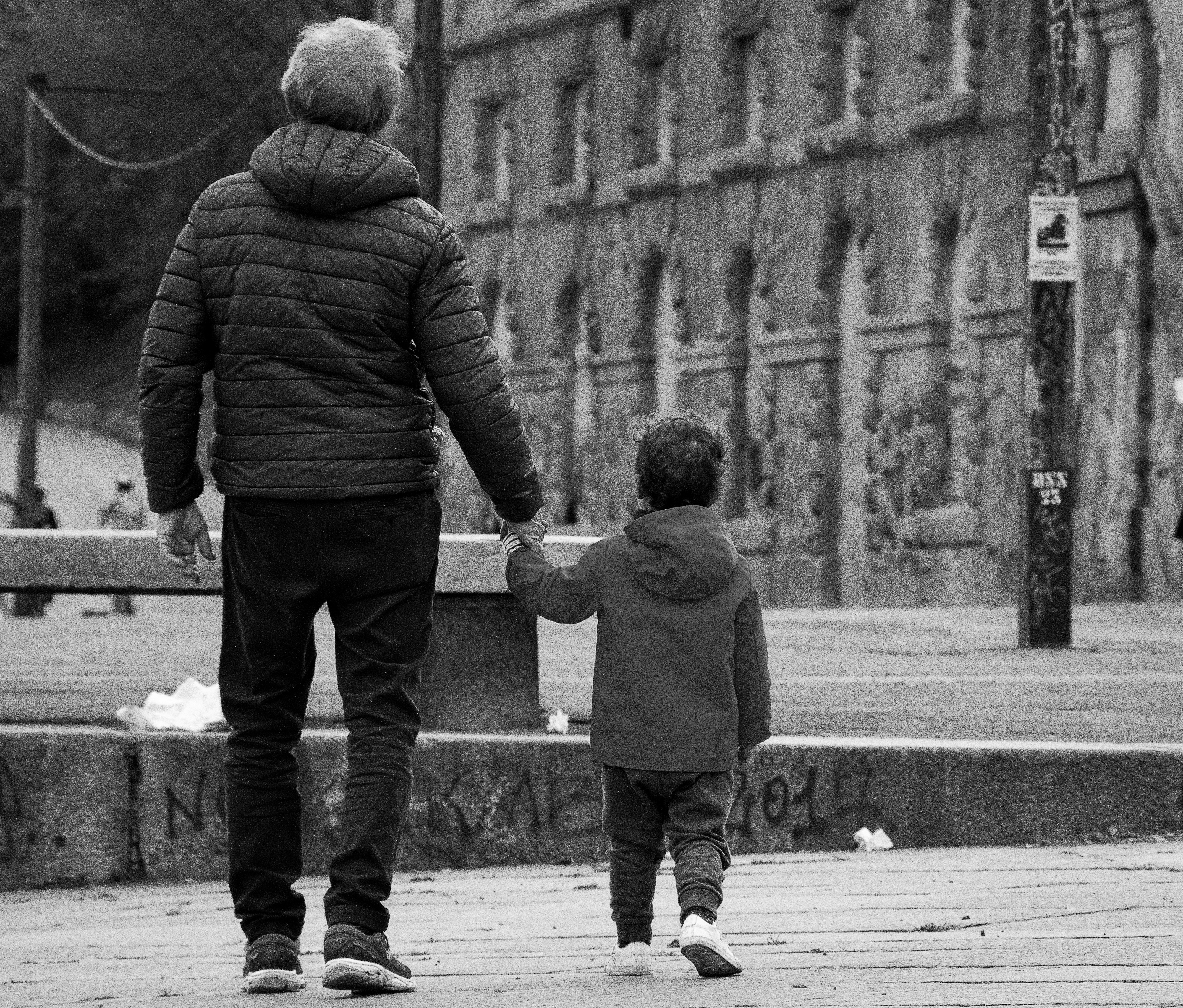father holding child's hand