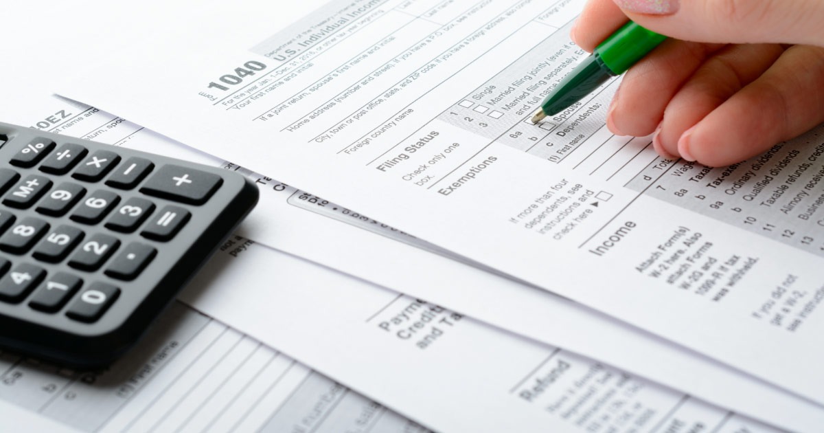 Woman filing out 1040 tax forms