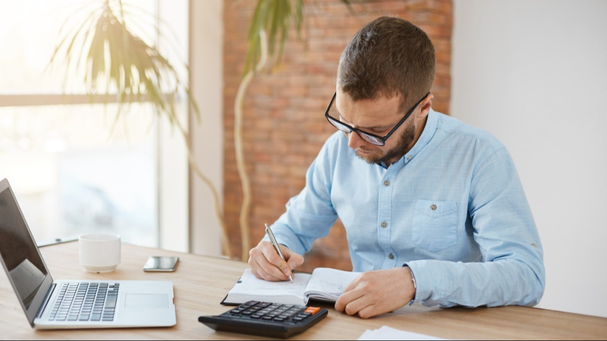 young man working on taxes