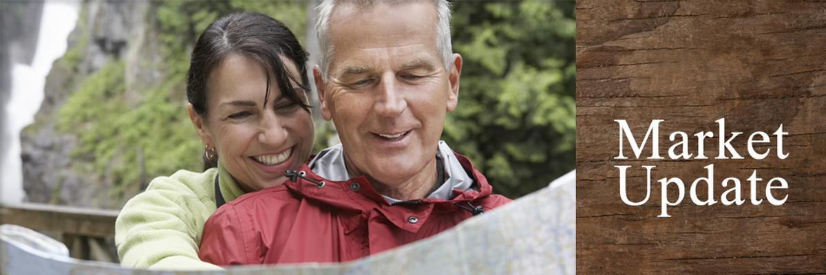 Market update banner: couple smiling while looking at map