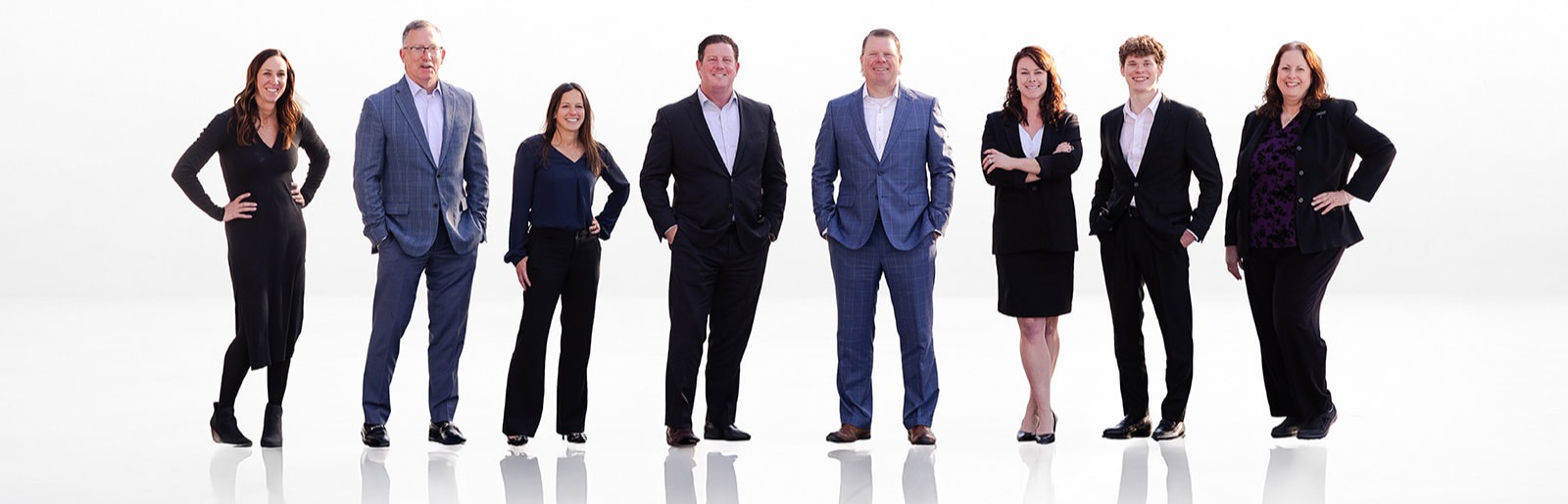 The eight members of the Adair & Associates team standing together