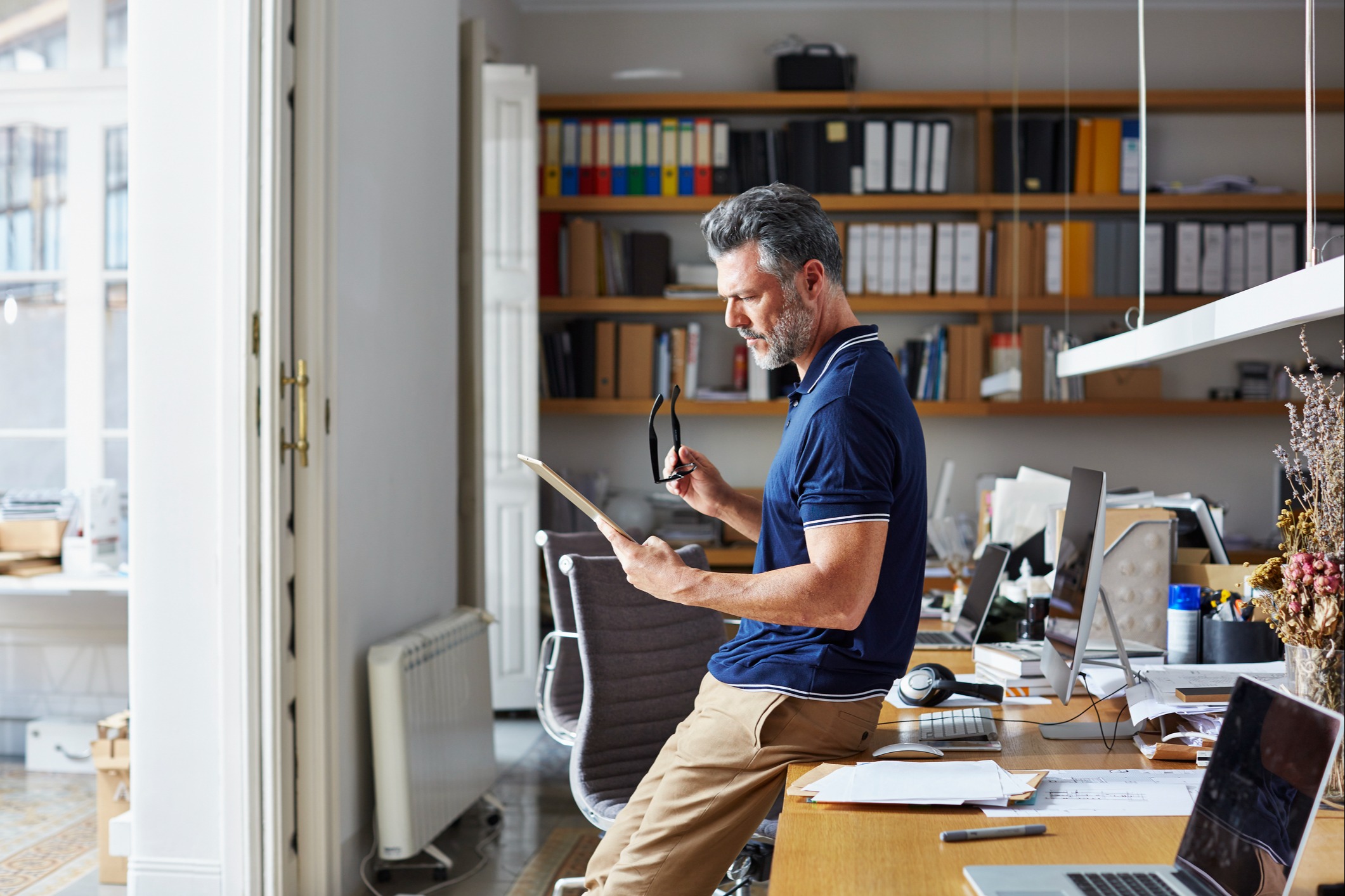 Man working on tablet in office