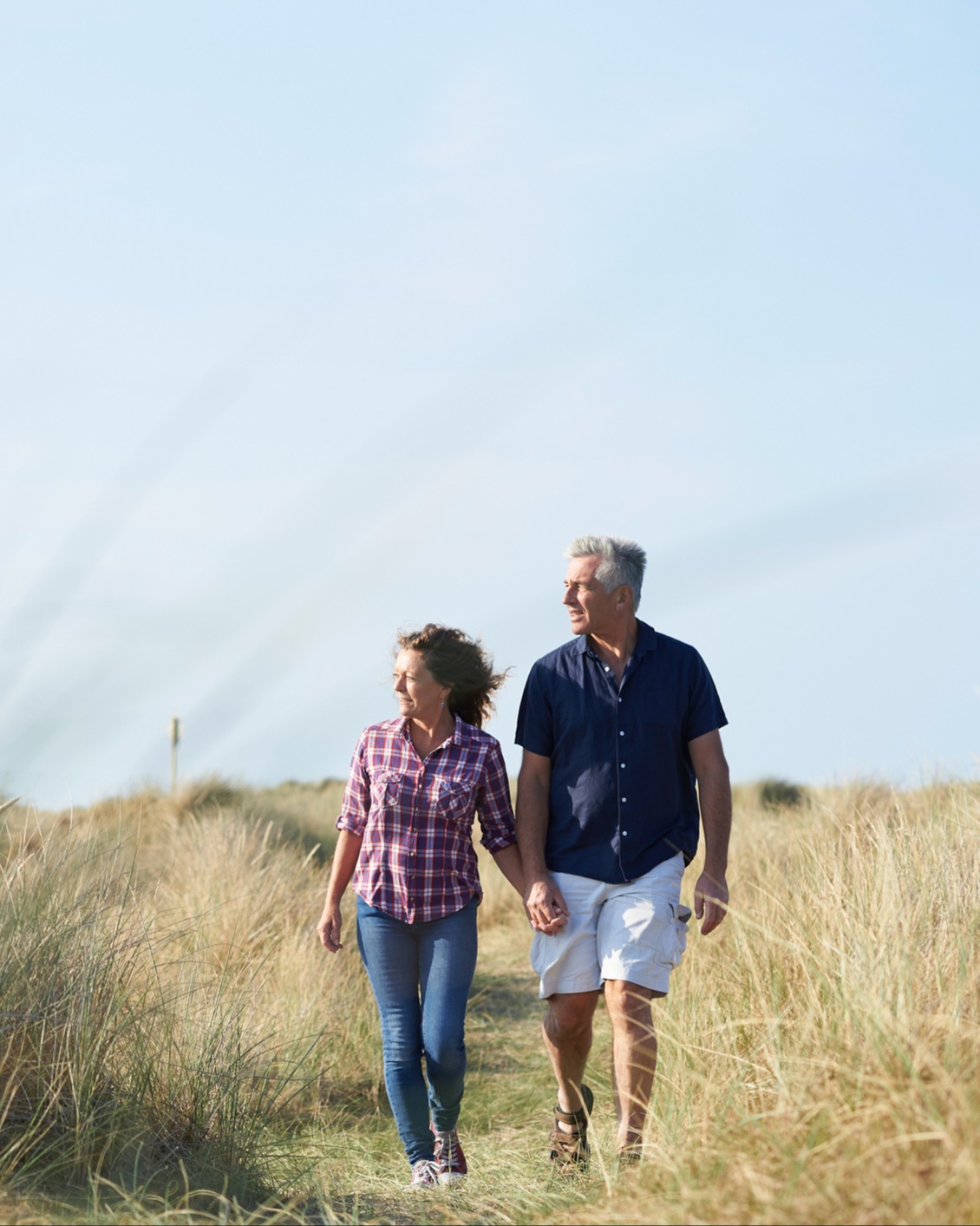 couple-walking-in-field