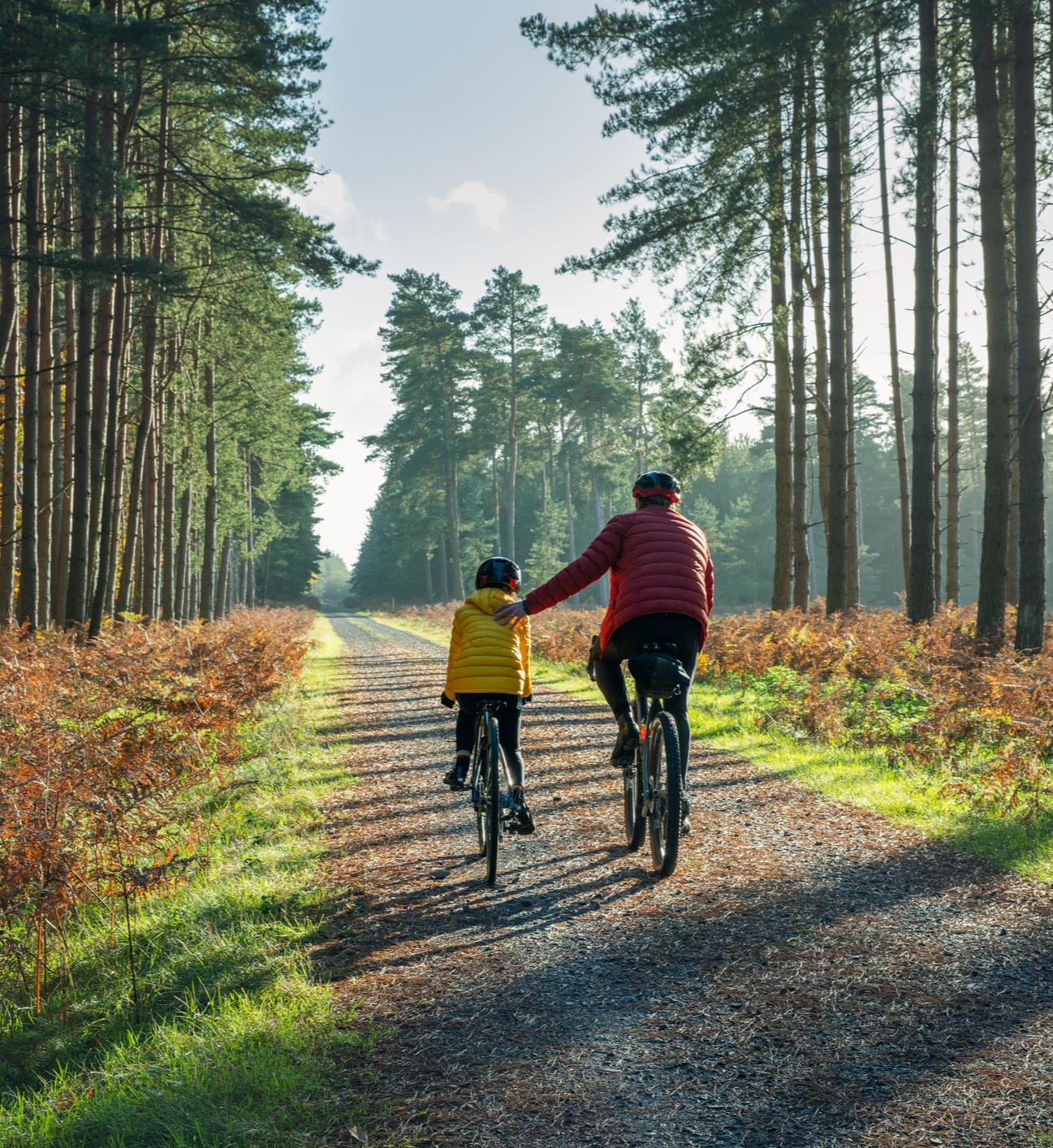 father-son-biking-in-forest