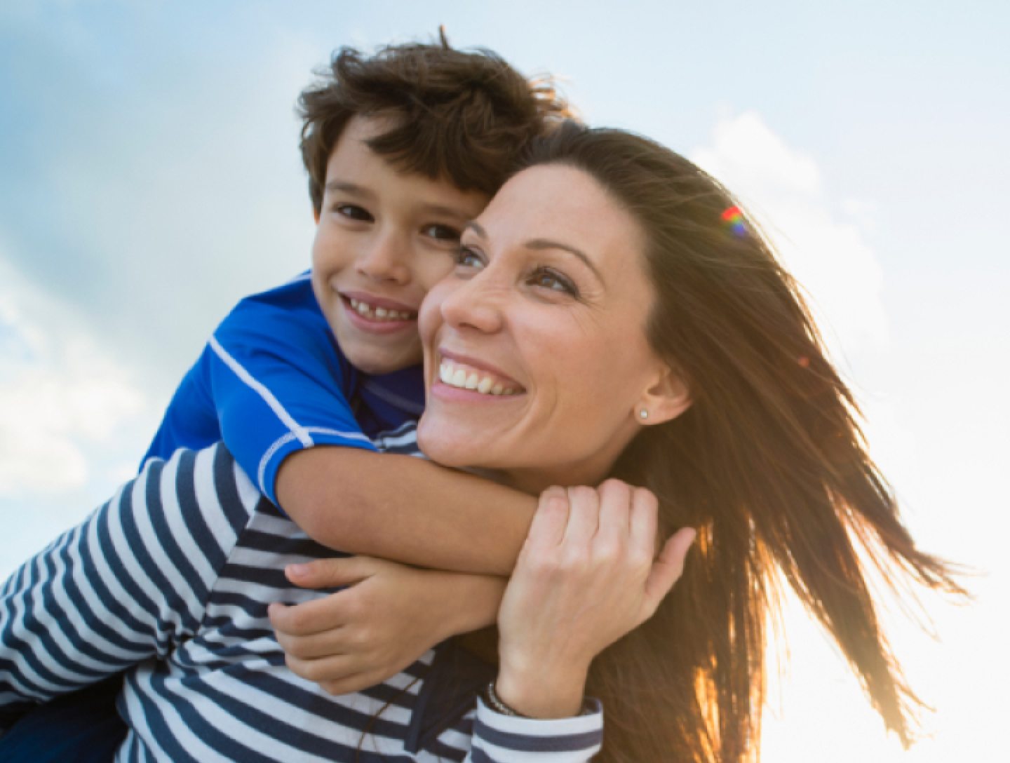 Woman carrying child on her back